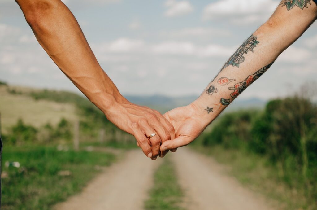 LGBT couple holding hands